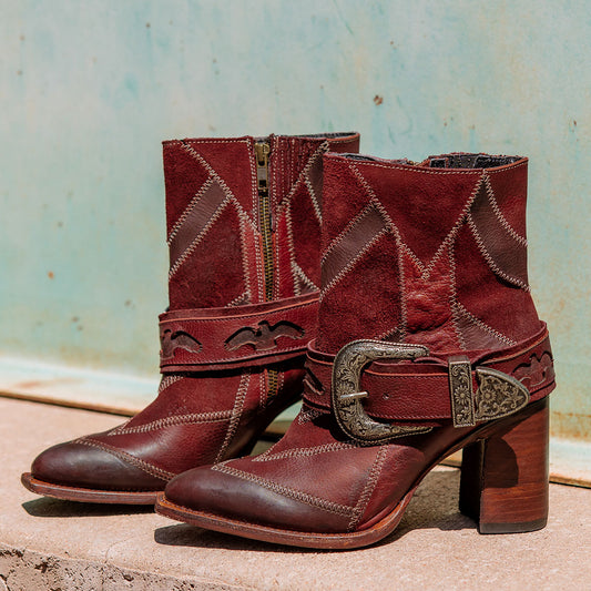 Freebird women's JAYMIE wine multi patchwork leather bootie with a removable buckle, lifted heel and pointed toe silhouette