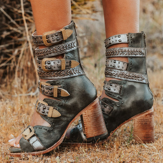 FREEBIRD women's Jett blue leather sandal with adjustable gold buckling, a high lifted heel and metallic chevron stitching 