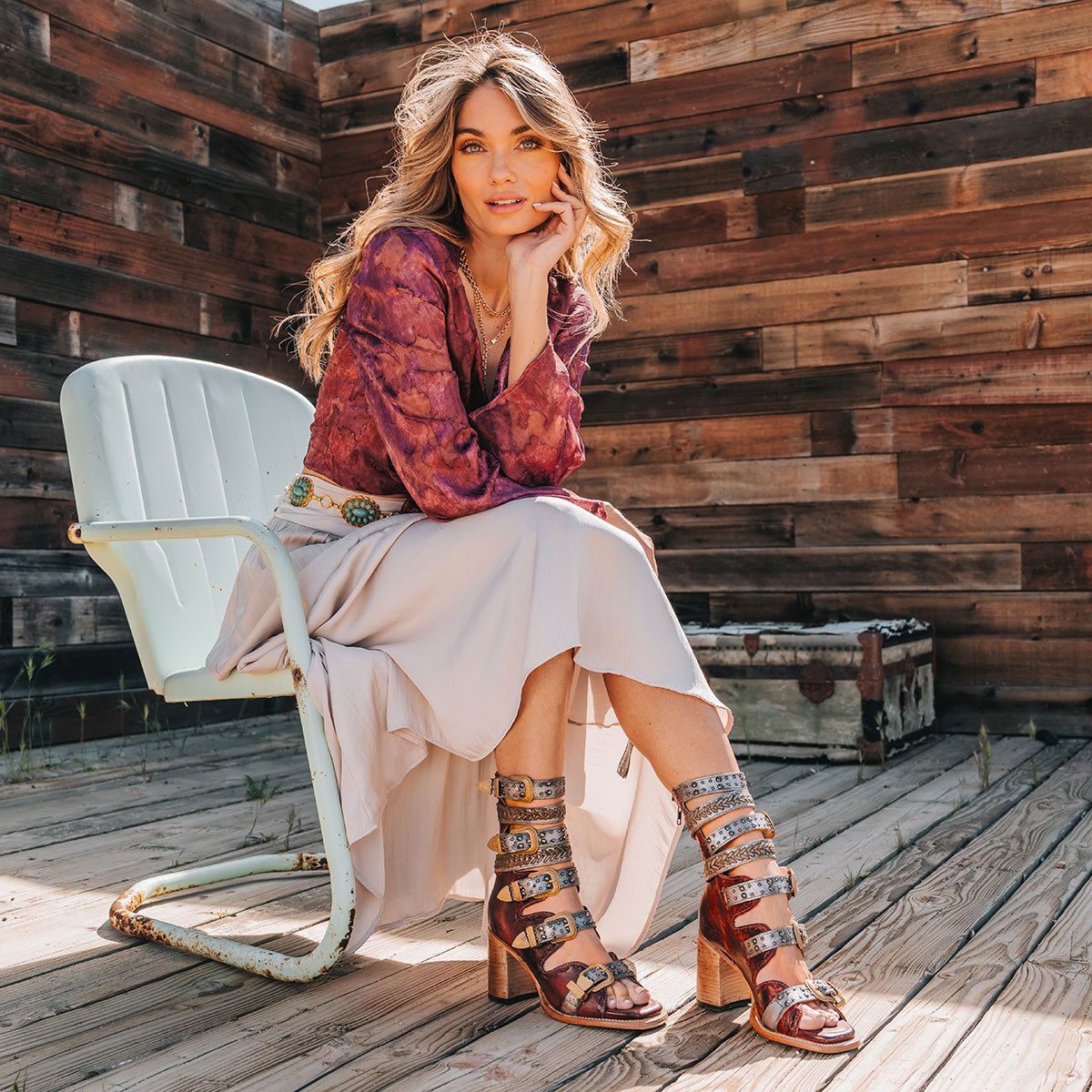 FREEBIRD women's Jett red leather sandal with adjustable gold buckling, a high lifted heel and metallic chevron stitching lifstyle