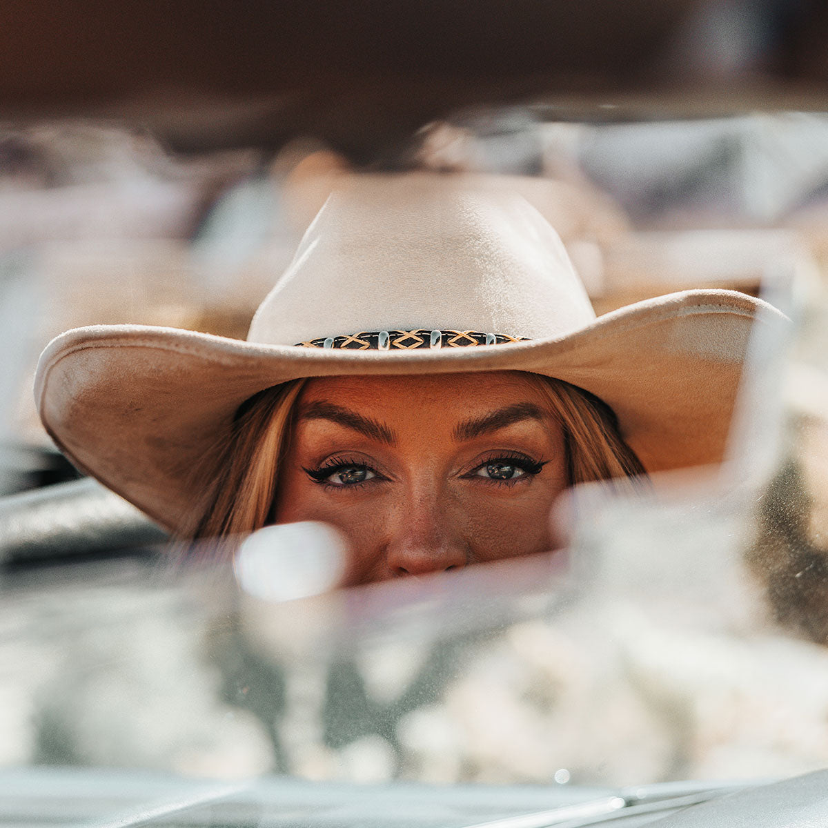 FREEBIRD Jones beige western cowboy hat featuring teardrop crown, upturned-brim, and braided leather band lifestyle