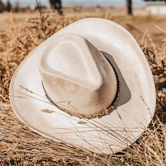 FREEBIRD Jones beige western cowboy hat featuring teardrop crown, upturned-brim, and braided leather band lifestyle