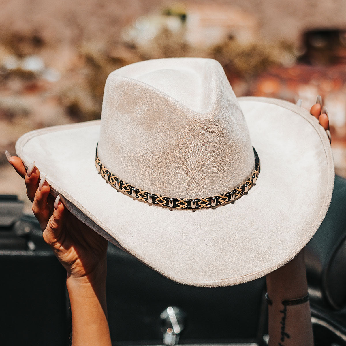 FREEBIRD Jones beige western cowboy hat featuring teardrop crown, upturned-brim, and braided leather band lifestyle