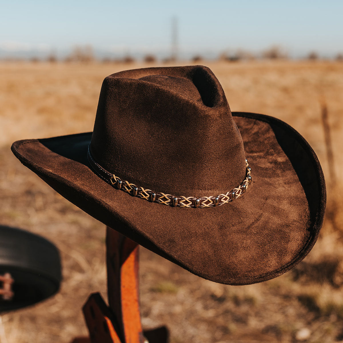 FREEBIRD Jones beige western cowboy hat featuring teardrop crown, upturned-brim, and braided leather band