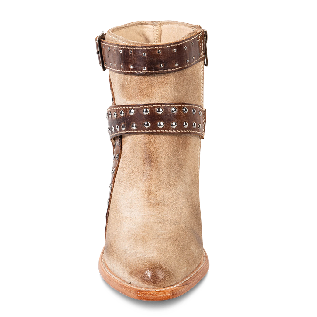 Front view showing contrasting solid leather straps with silver stud detailing on FREEBIRD women's Jovi beige suede bootie