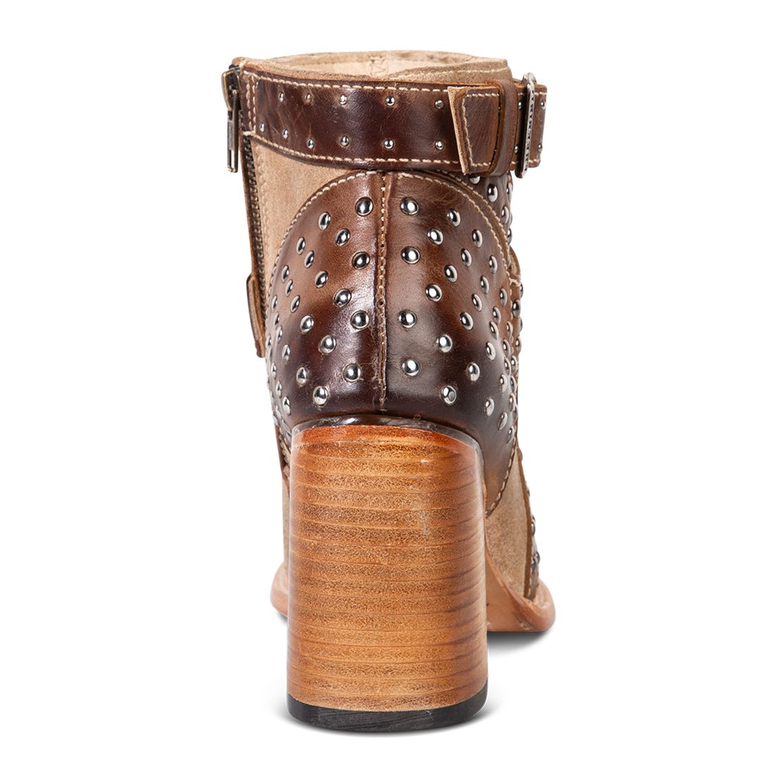 Back view showing stacked flare heel and silver stud accents on FREEBIRD women's Jovi beige suede bootie