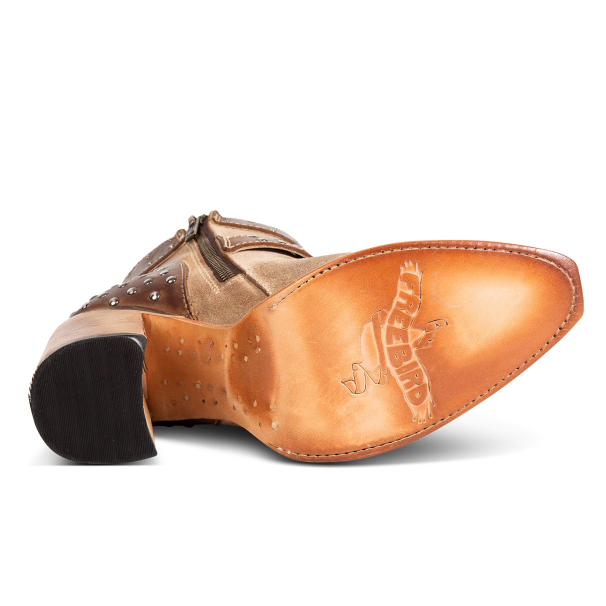 Tan leather sole imprinted with FREEBIRD on women's Jovi beige suede bootie