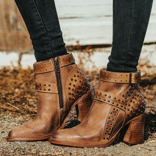 FREEBIRD women's Jovi cognac suede bootie with inside zip closure, flare heel, and stud detailing 