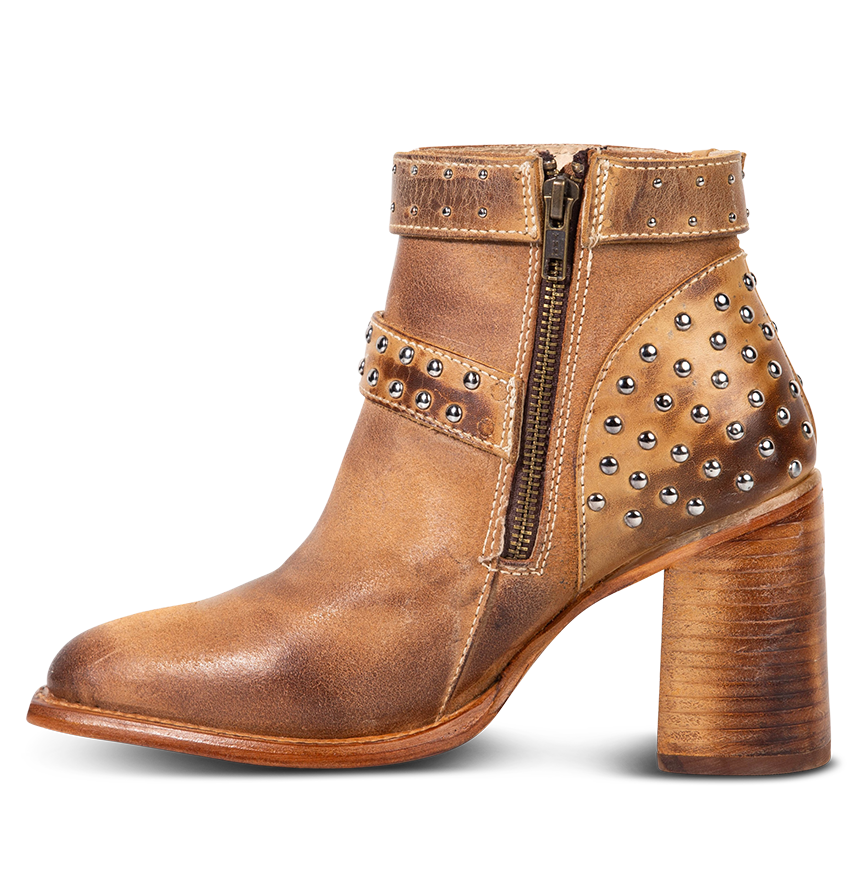 Inside view showing working brass zip closure and contrasting leather detailing on FREEBIRD women's Jovi cognac suede bootie