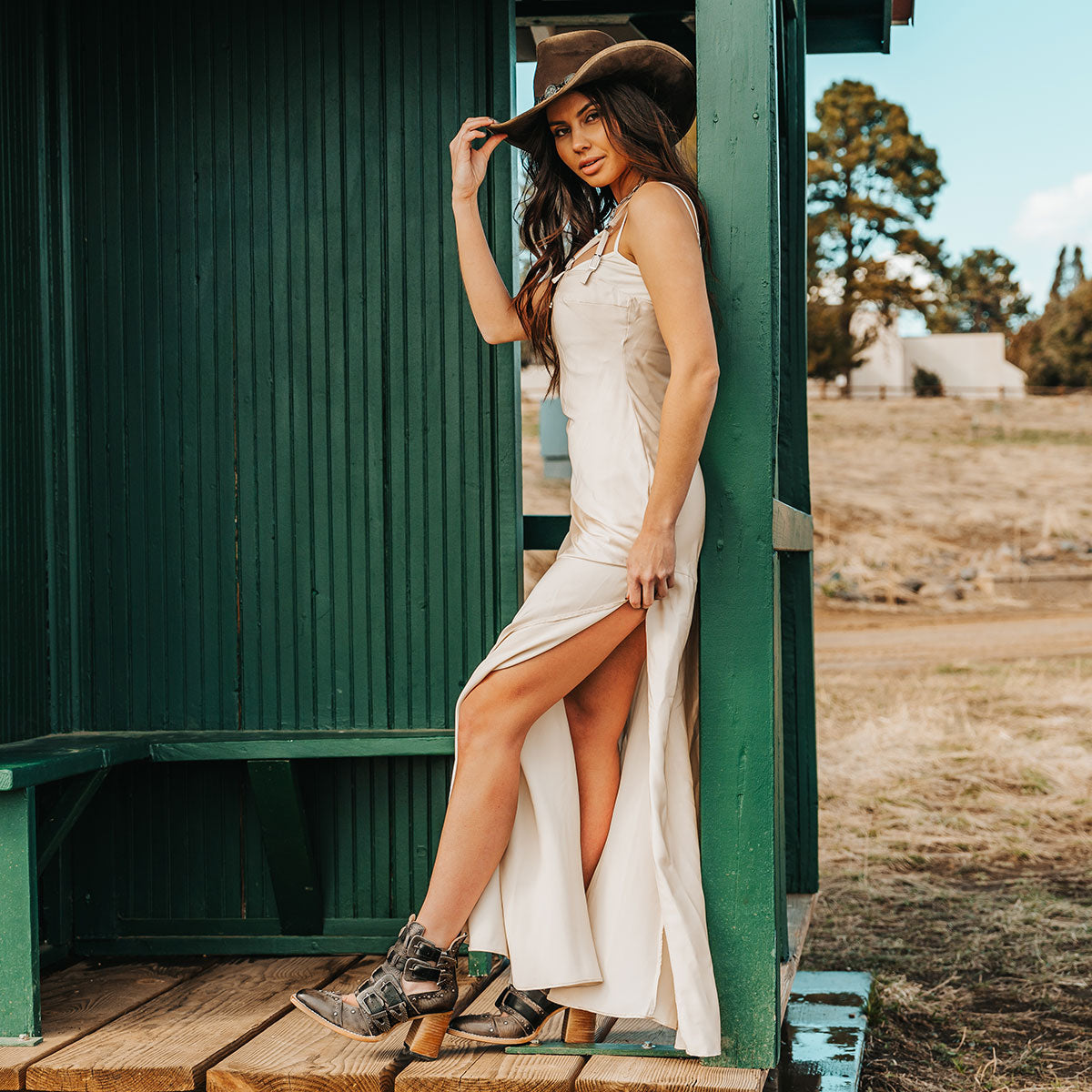 FREEBIRD women's Judge black leather bootie with engraved belts, contrating metal embellishments and a stacked heel lifestyle