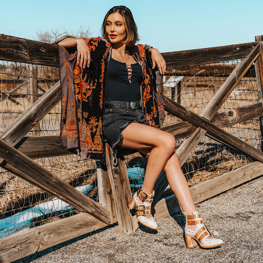 FREEBIRD women's Judge off white leather bootie with engraved belts, contrating metal embellishments and a stacked heel lifestyle
