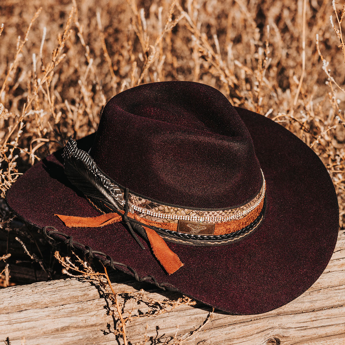 FREEBIRD Kit wool purple hat with a curved brim, pinched teardrop crown and decorated brim