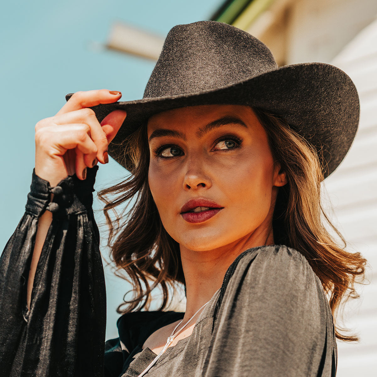 FREEBIRD women's Kolten dark grey wool hat with a curved brim, front pinch crown and silk bandana interior lifestyle