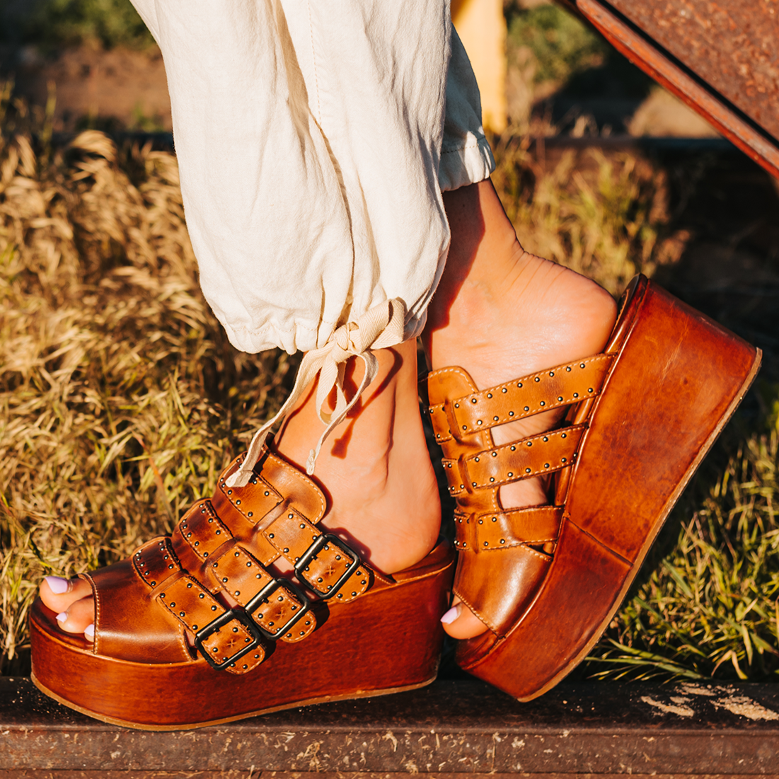 FREEBIRD women's Landi cognac slip-on sandal with adjustable straps and platform heel