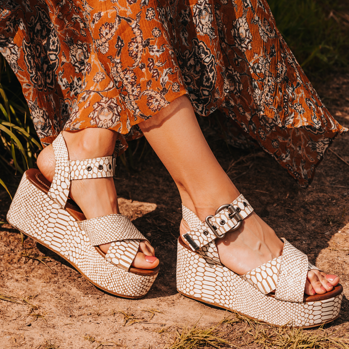 FREEBIRD women's Larae white snake wedge sandal with platform heel and an adjustable ankle strap