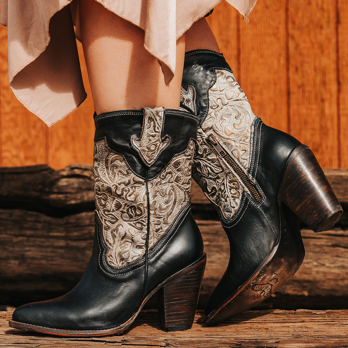 FREEBIRD women's Loretta black leather boot with a tooled 100% full grain shaft, inside zip closure and  inverted heel 