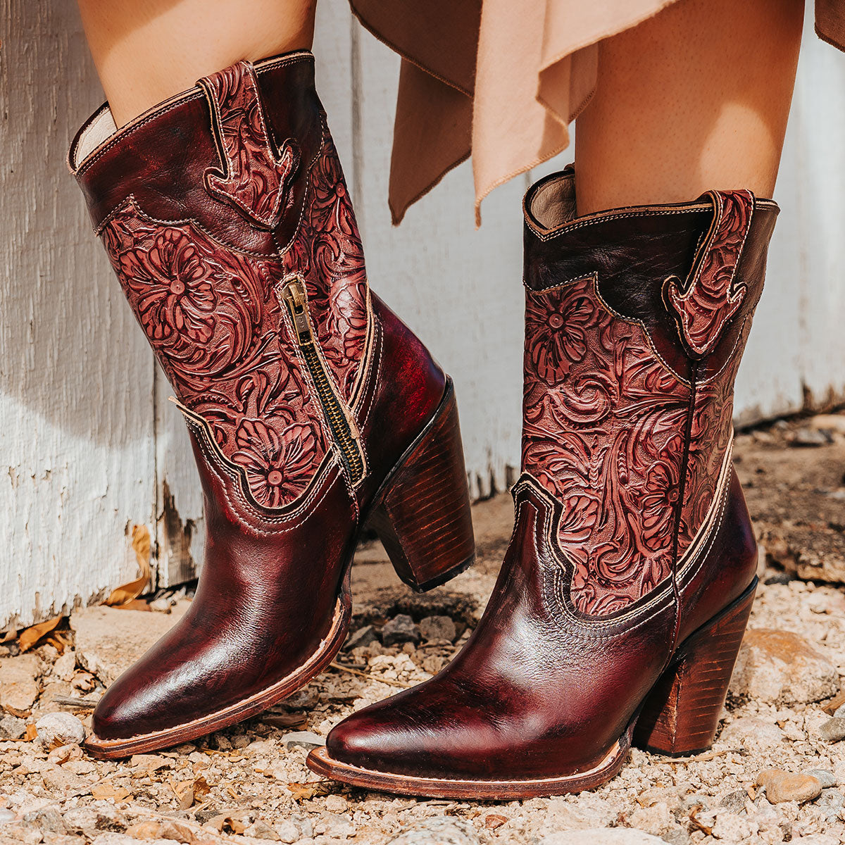 FREEBIRD women's Loretta wine leather boot with a tooled 100% full grain shaft, inside zip closure and inverted heel 