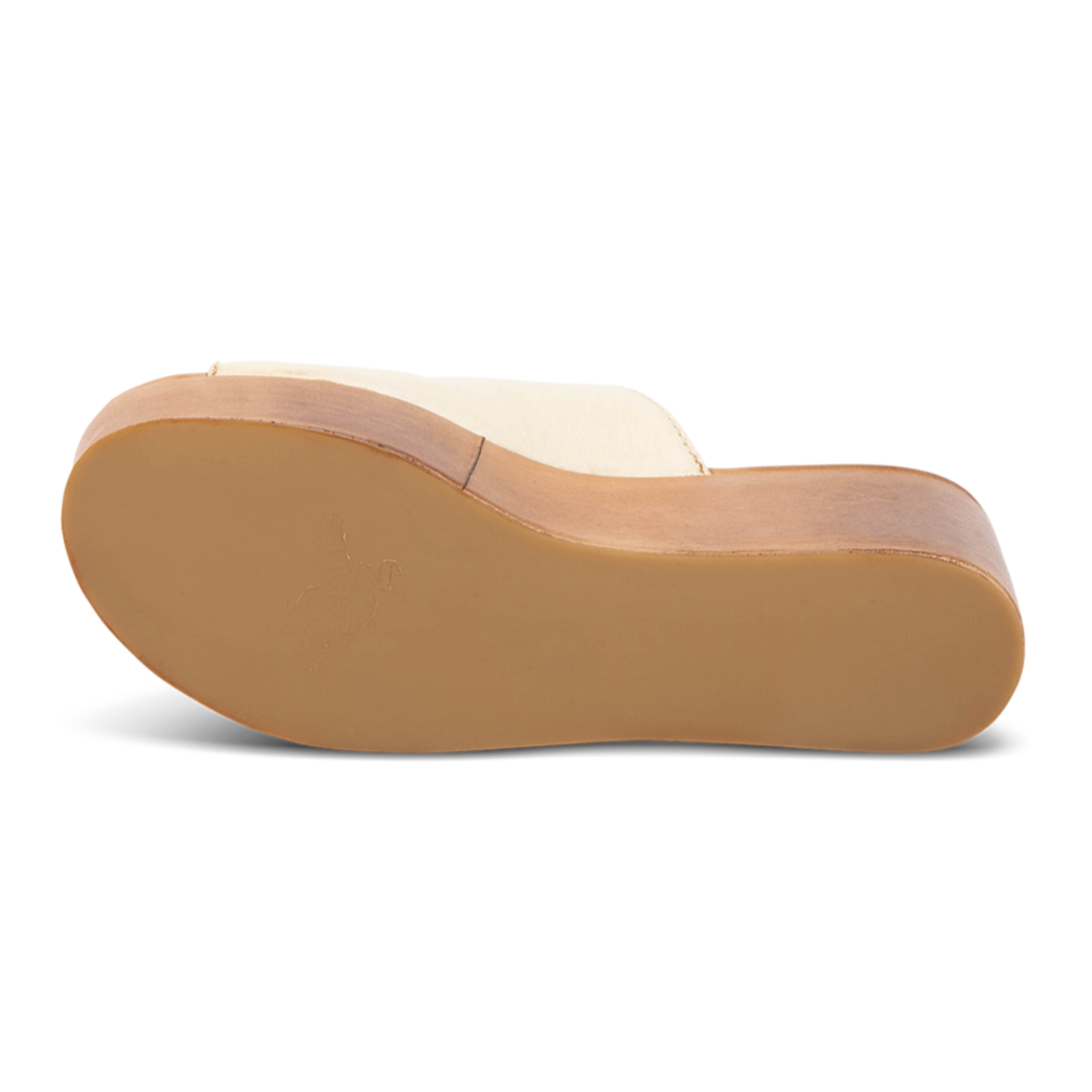 Rubber sole imprinted with FREEBIRD on women's Loveland beige platform sandal