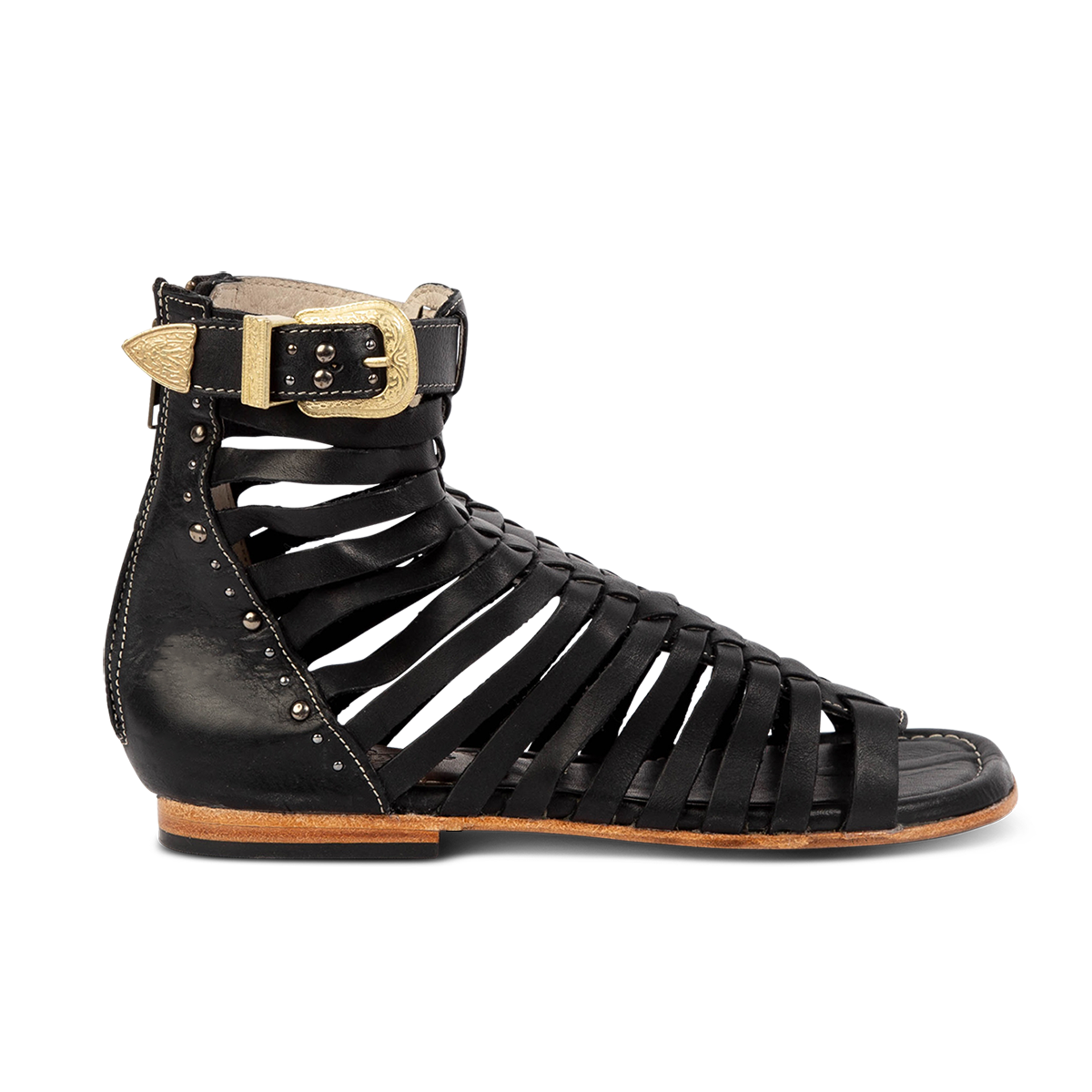 FREEBIRD women's Luna black leather sandal with a gladiator silhouette, adjustable brass buckle and subtle stud embellishments on a low heel lifestyle