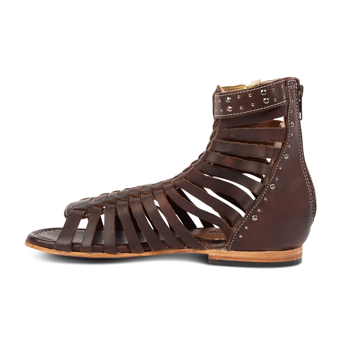 Inside view show FREEBIRD women's Luna brown leather sandal with a gladiator silhouette, adjustable brass buckle and subtle stud embellishments on a low heel 
