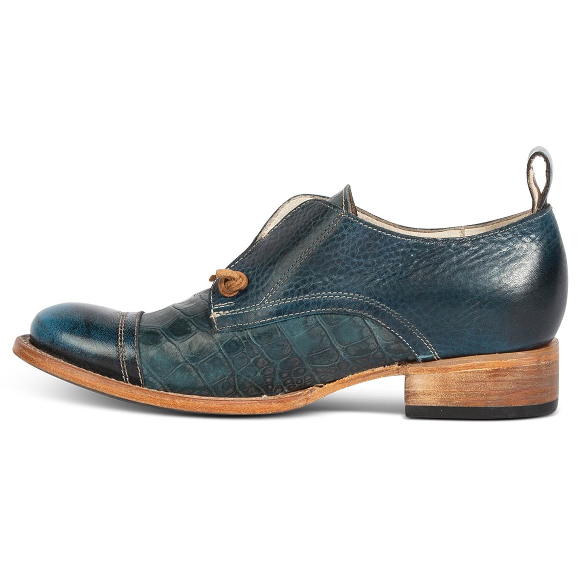 Inside view showing stitch detailing and low heel on FREEBIRD women's Mabel blue multi shoe