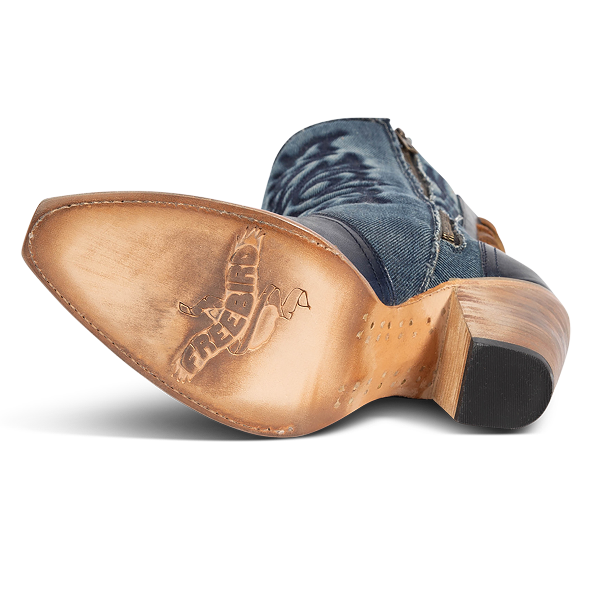Leather sole imprinted with FREEBIRD on women's Magnolia blue denim and leather boot