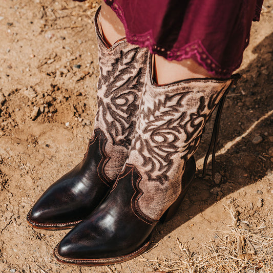 FREEBIRD women's Magnolia brown denim and leather boot with mono shaft stitching, back panel lacing and a curved pointed toe silhouette 