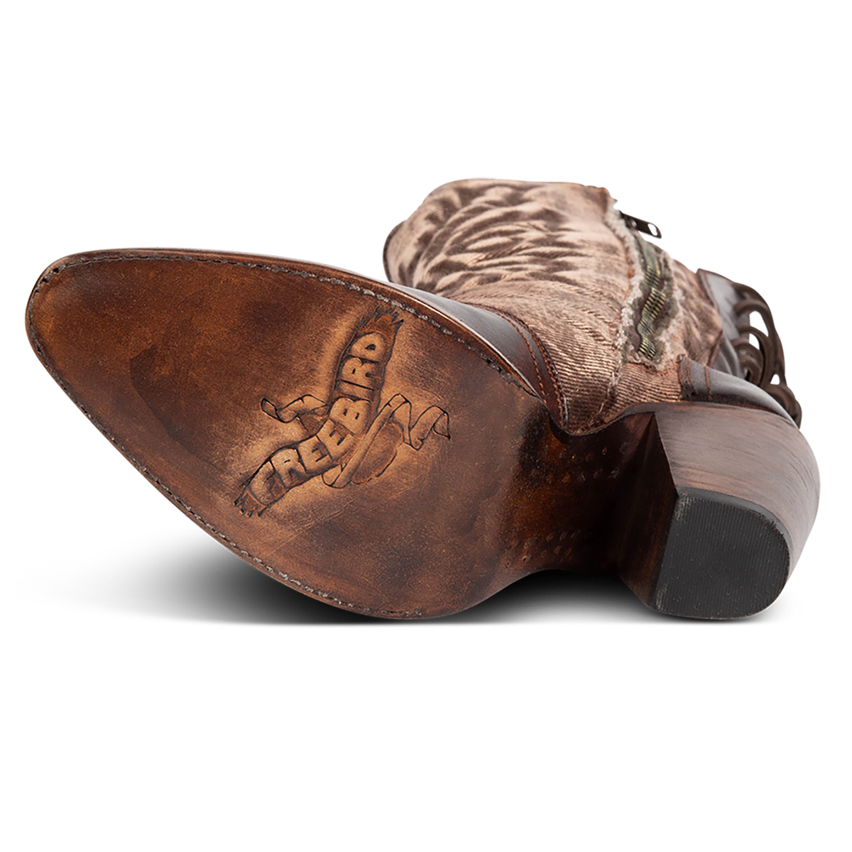 Leather sole imprinted with FREEBIRD on women's Magnolia brown denim and leather boot