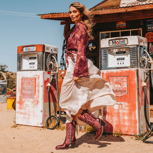 FREEBIRD women's Magnolia red denim and leather boot with mono shaft stitching, back panel lacing and a curved pointed toe silhouette lifestyle