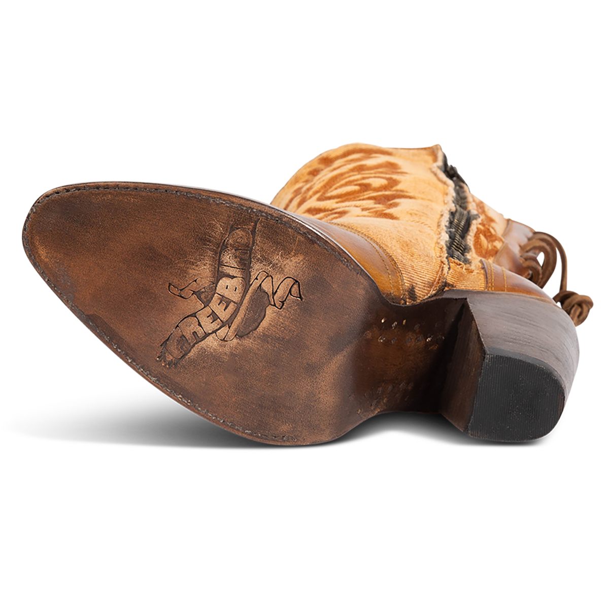 Leather sole imprinted with FREEBIRD on women's Magnolia tan denim and leather boot