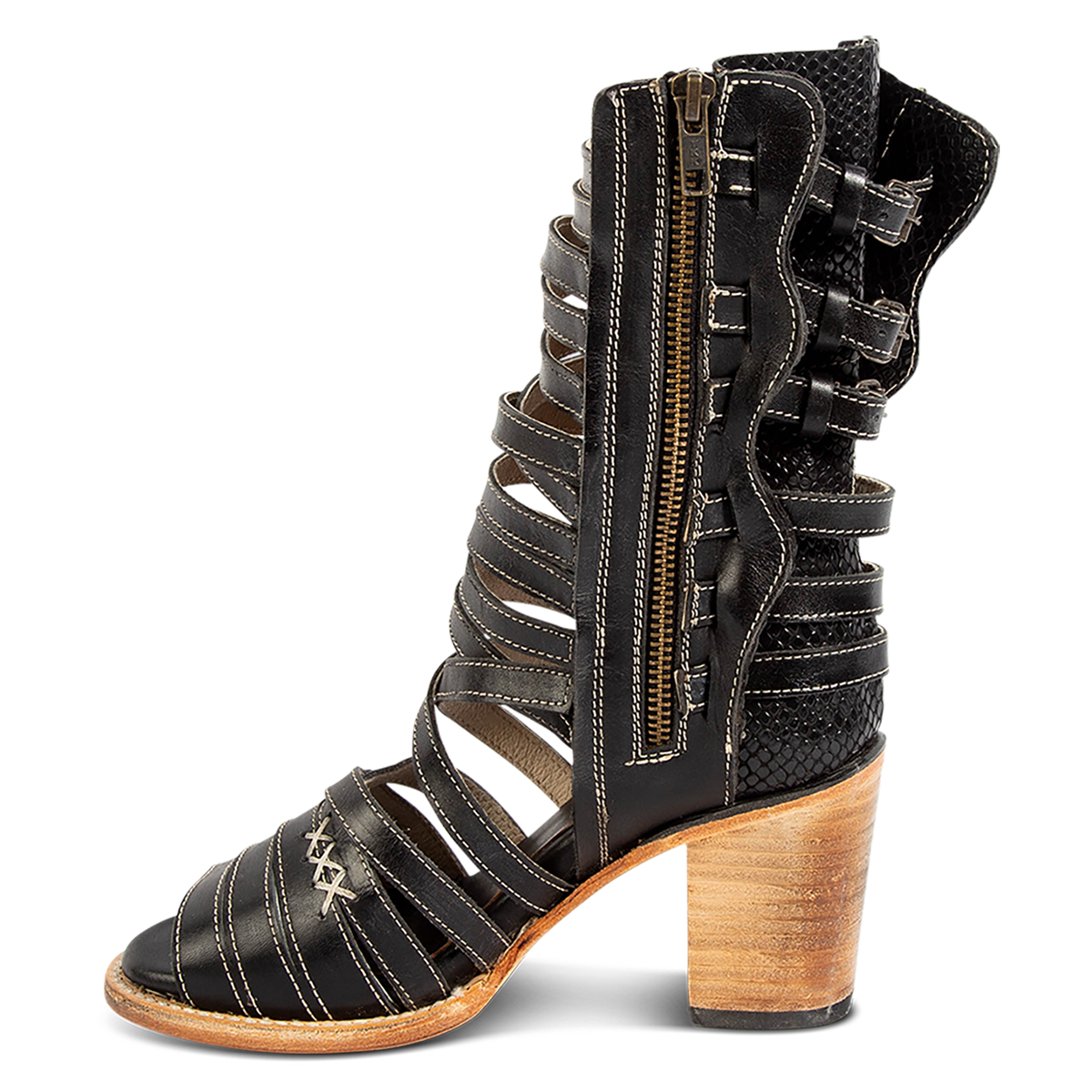 Inside view showing a working brass zipper, block heel and leather straps on FREEBIRD women's Makayla black leather sandal