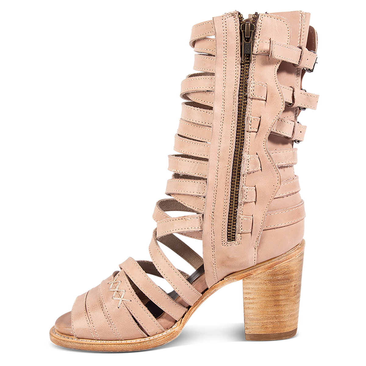 Inside view showing a working brass zipper, block heel and leather straps on FREEBIRD women's Makayla blush leather sandal