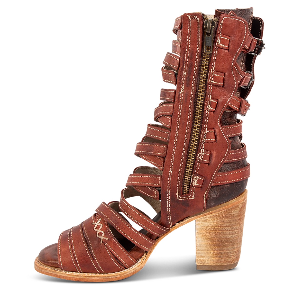 Inside view showing a working brass zipper, block heel and leather straps on FREEBIRD women's Makayla rust leather sandal