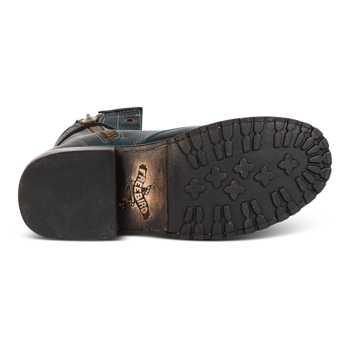 Tread sole imprinted with FREEBIRD on women's Manchester blue multi leather combat bootie