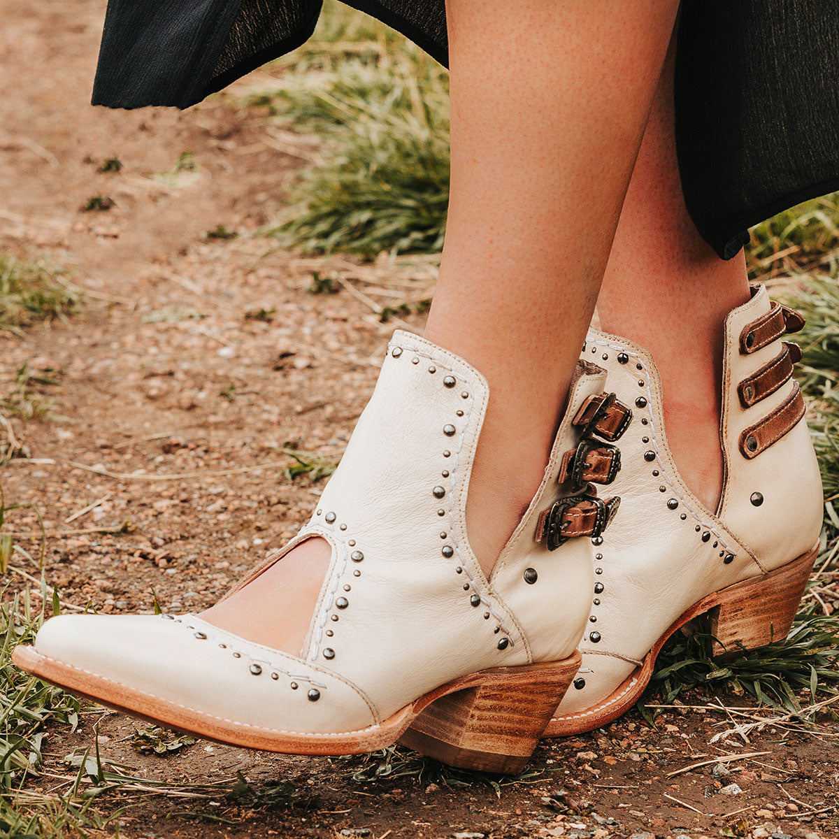 FREEBIRD women's Melody beige leather shoe with v-cut sides, stud detailing, and low heel