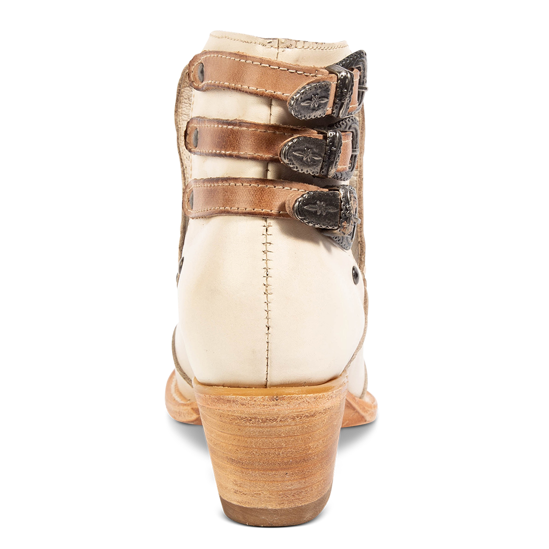 Back view showing s low stacked heel and contrasting heel straps with silver hardware on FREEBIRD women's Melody beige leather shoe
