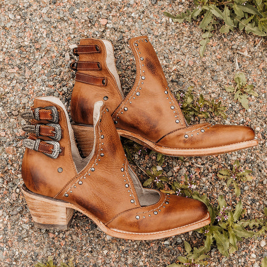 FREEBIRD women's Melody tan leather shoe with v-cut sides, stud detailing, and low heel
