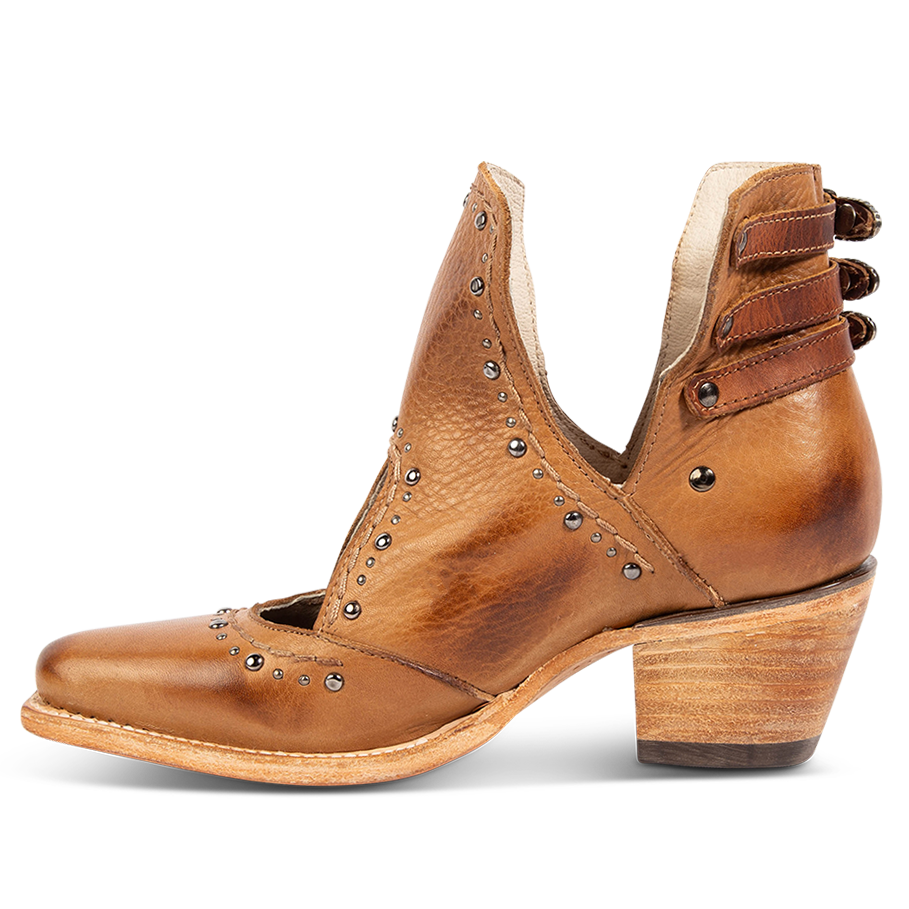 Inside view showing v-cut sides, stud trim detailing, and contrasting heel straps on FREEBIRD women's Melody tan leather shoe