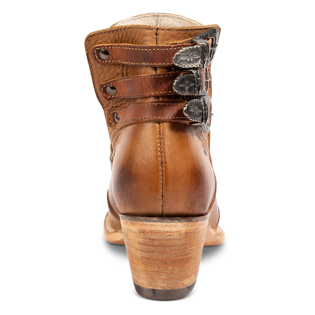 Back view showing s low stacked heel and contrasting heel straps with silver hardware on FREEBIRD women's Melody tan leather shoe