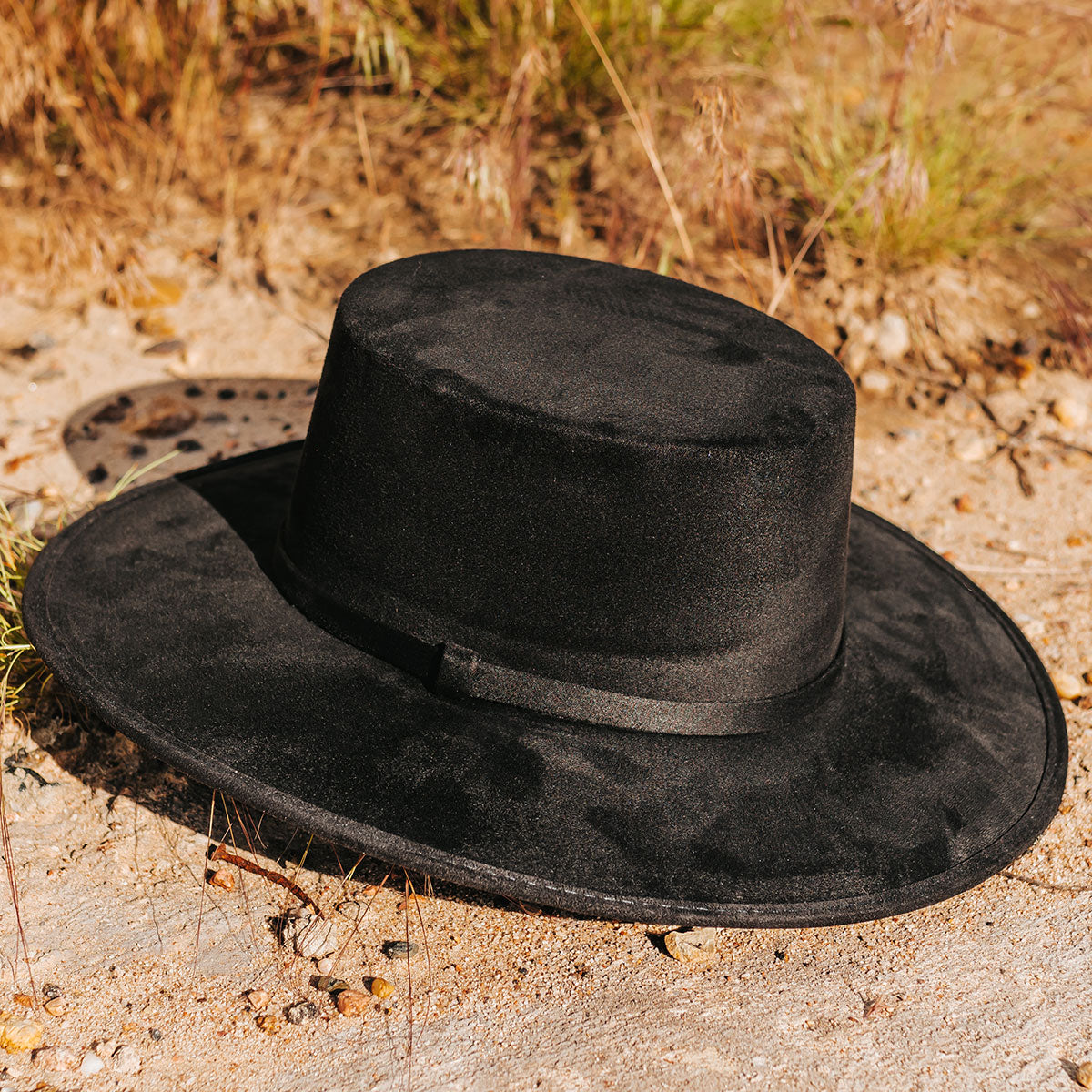 FREEBIRD Moonshine black flat wide-brim hat featuring boater-shaped crown and tonal band