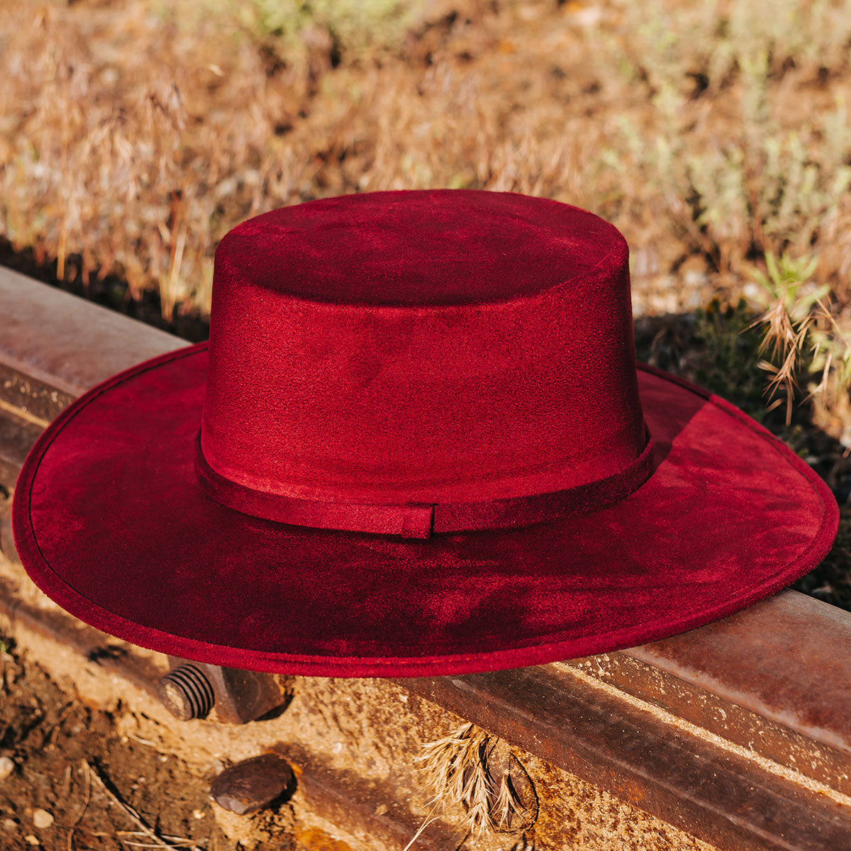FREEBIRD Moonshine wine flat wide-brim hat featuring boater-shaped crown and tonal band