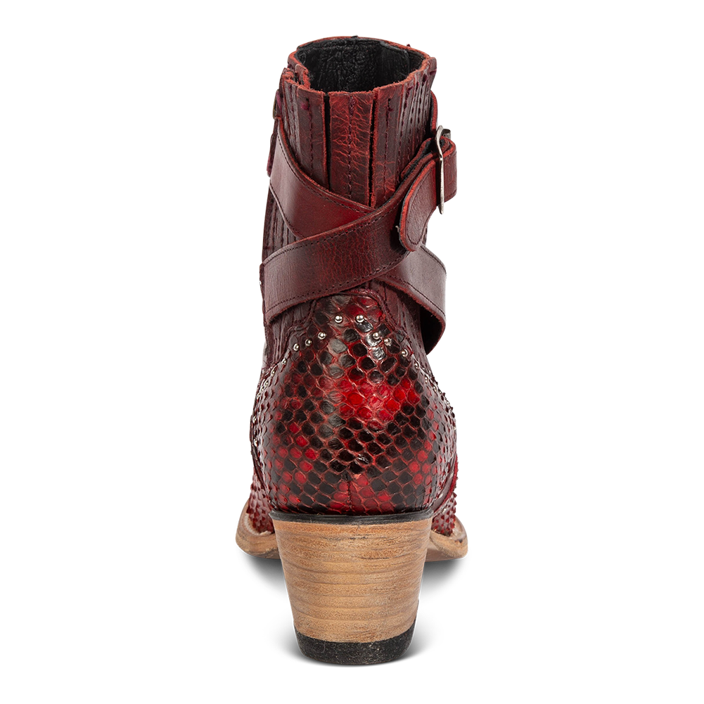 Back view showing wooden heel, gore detailing, and buckle straps on FREEBIRD women's Morgan red python leather ankle bootie