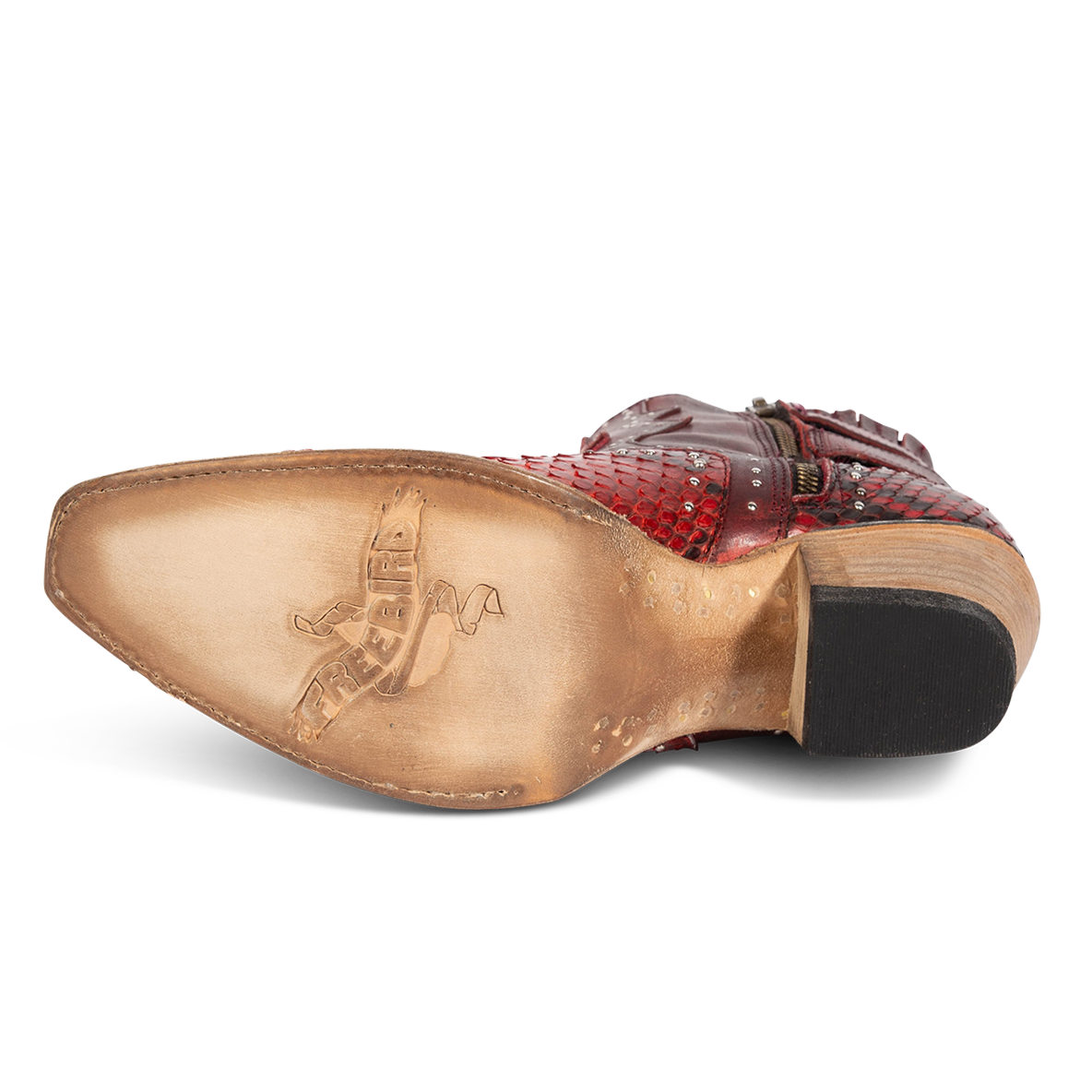 Leather sole imprinted with FREEBIRD on women's Morgan red python leather ankle bootie