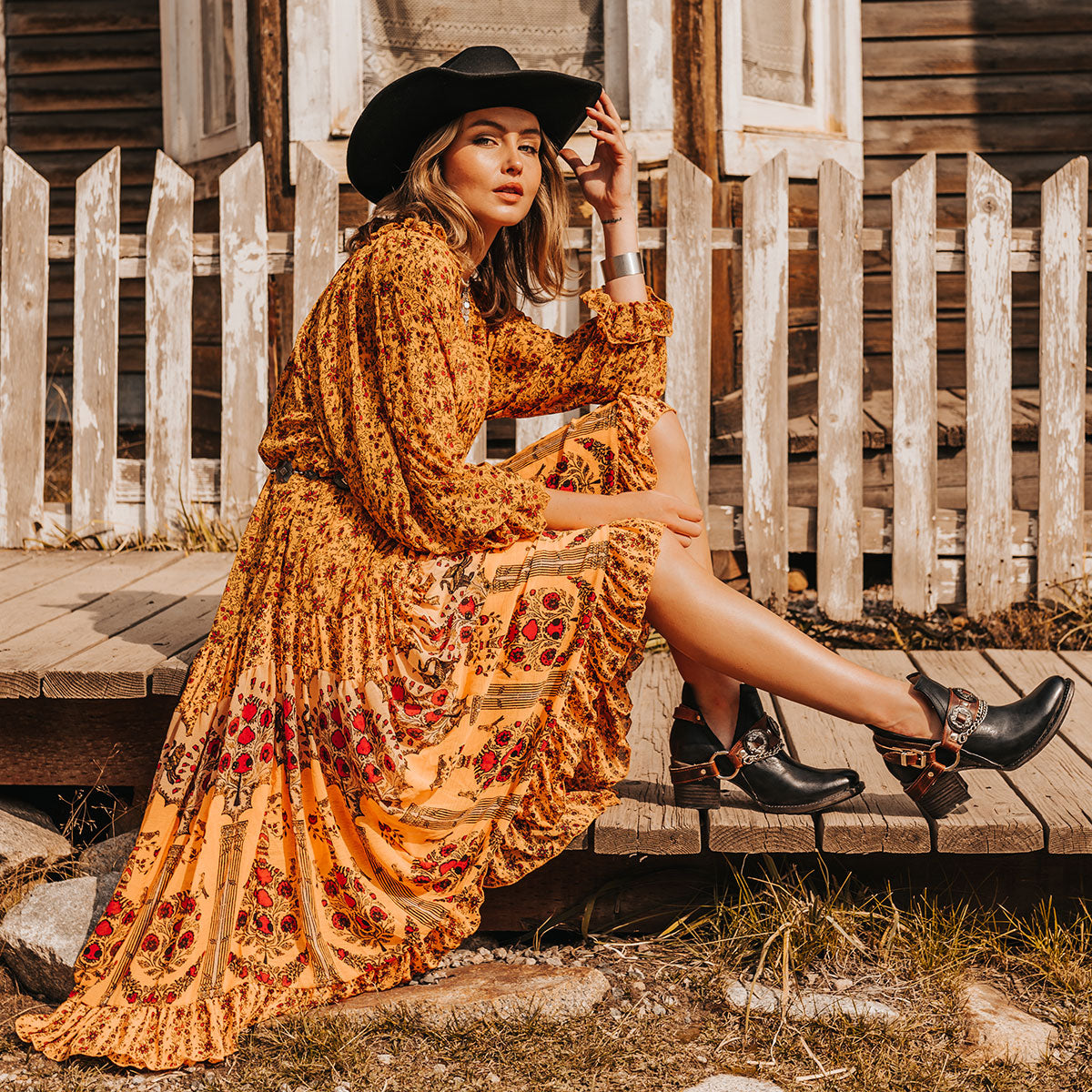 FREEBIRD women's Mystic black leather belted embellished bootie with ankle framing cuts lifestyle image