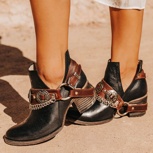 FREEBIRD women's Mystic black leather belted embellished bootie with ankle framing cuts