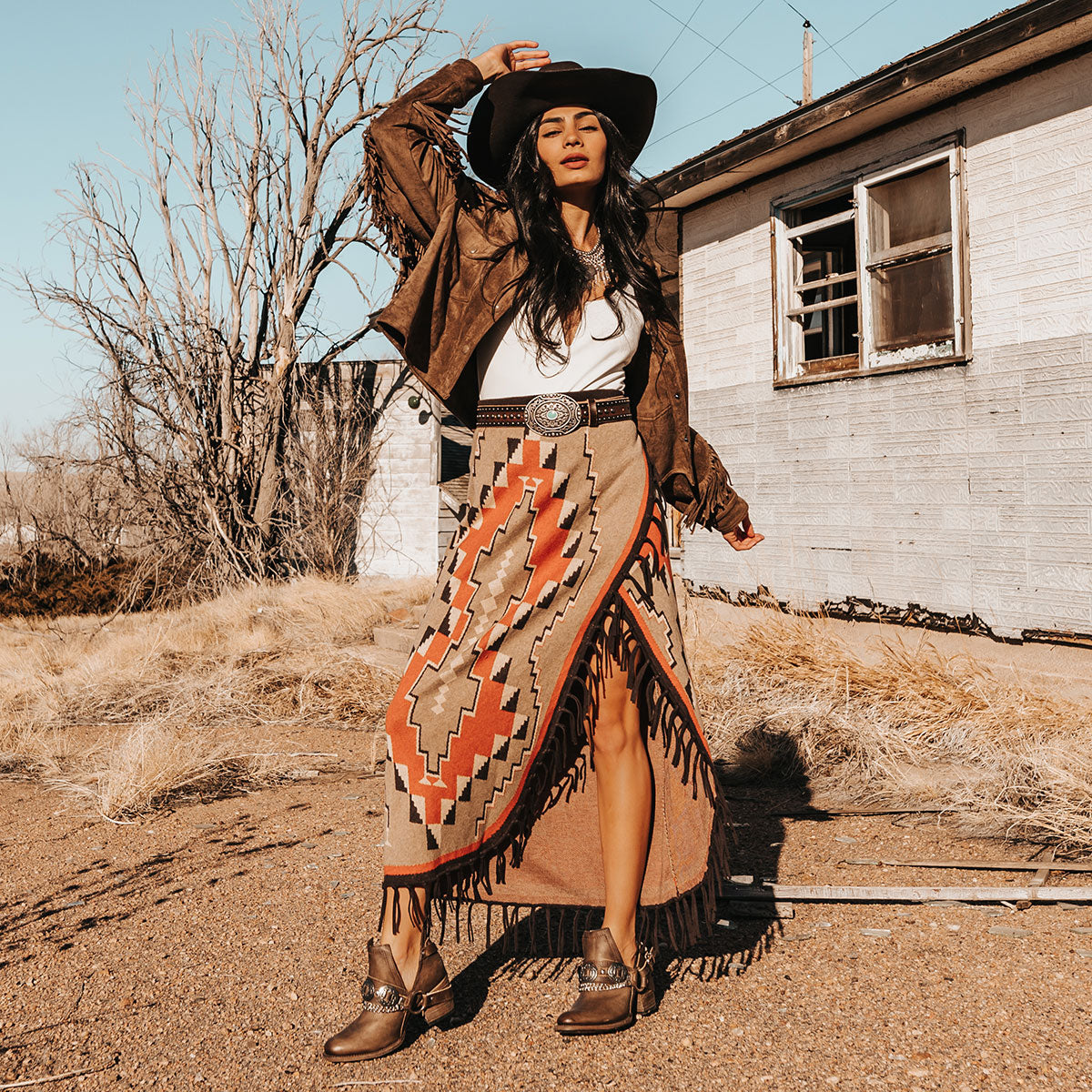 FREEBIRD women's Mystic brown leather belted embellished bootie with ankle framing cuts lifestyle image