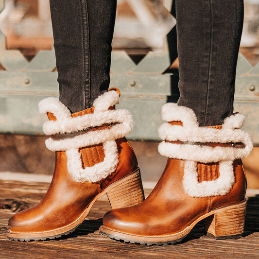 FREEBIRD women's Neverland tan leather bootie with genuine shearling decorative lining, gore detailing and a rubber tread sole 