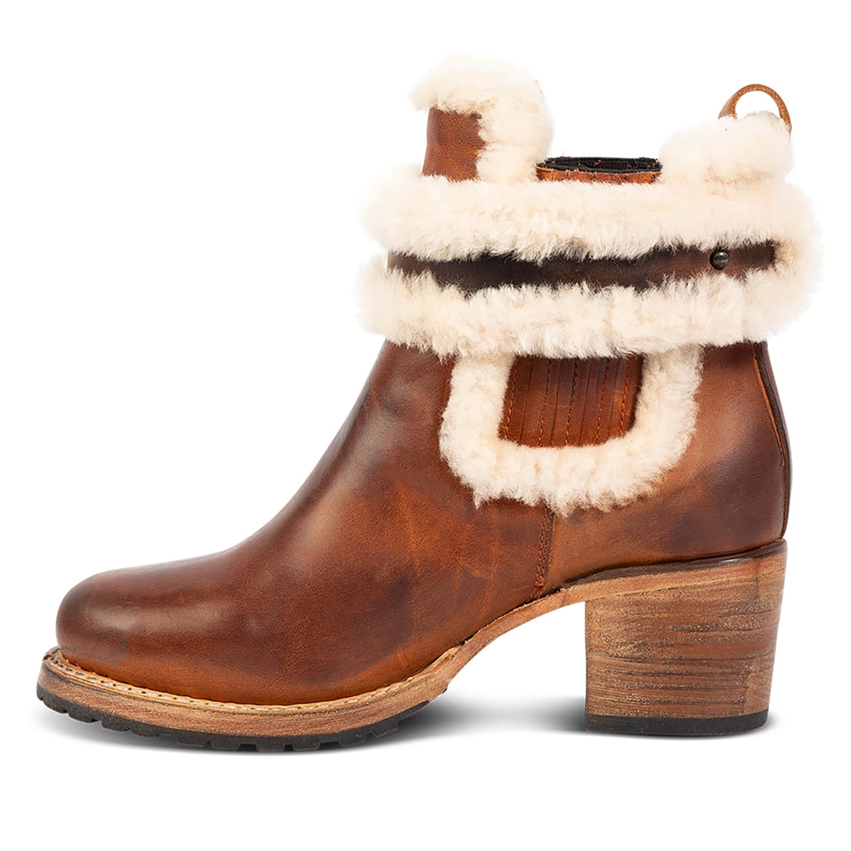 Inside view showing genuine shearling lining and a stacked heel on FREEBIRD women's Neverland tan leather bootie