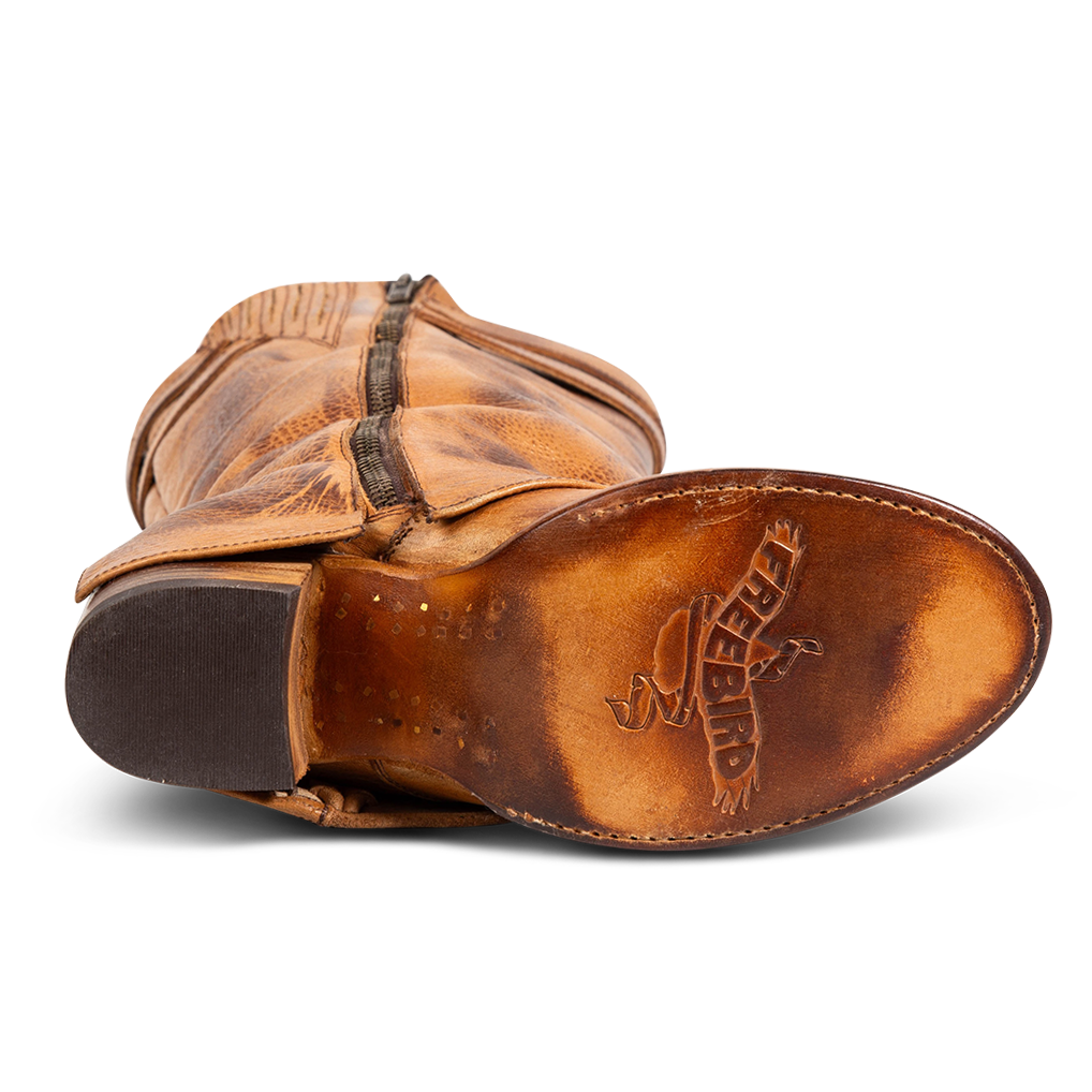 Tan leather sole imprinted with FREEBIRD on women's Nighthawk wheat boot