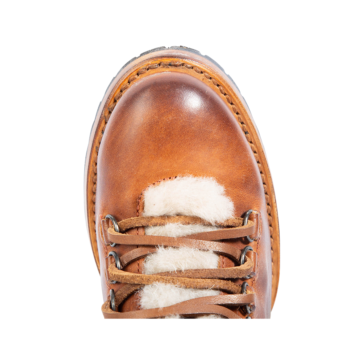 Top view showing round toe and shearling tongue on FREEBIRD women's Norway tan leather bootie