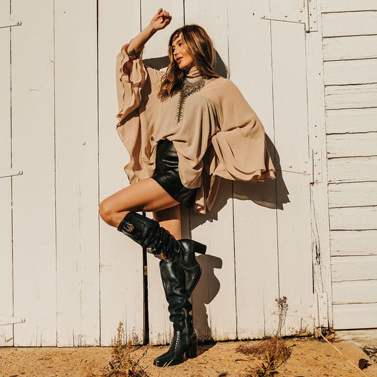 FREEBIRD women's Paisley black suede knee high boot with whipstitch detailing and brass zip closure lifestyle image